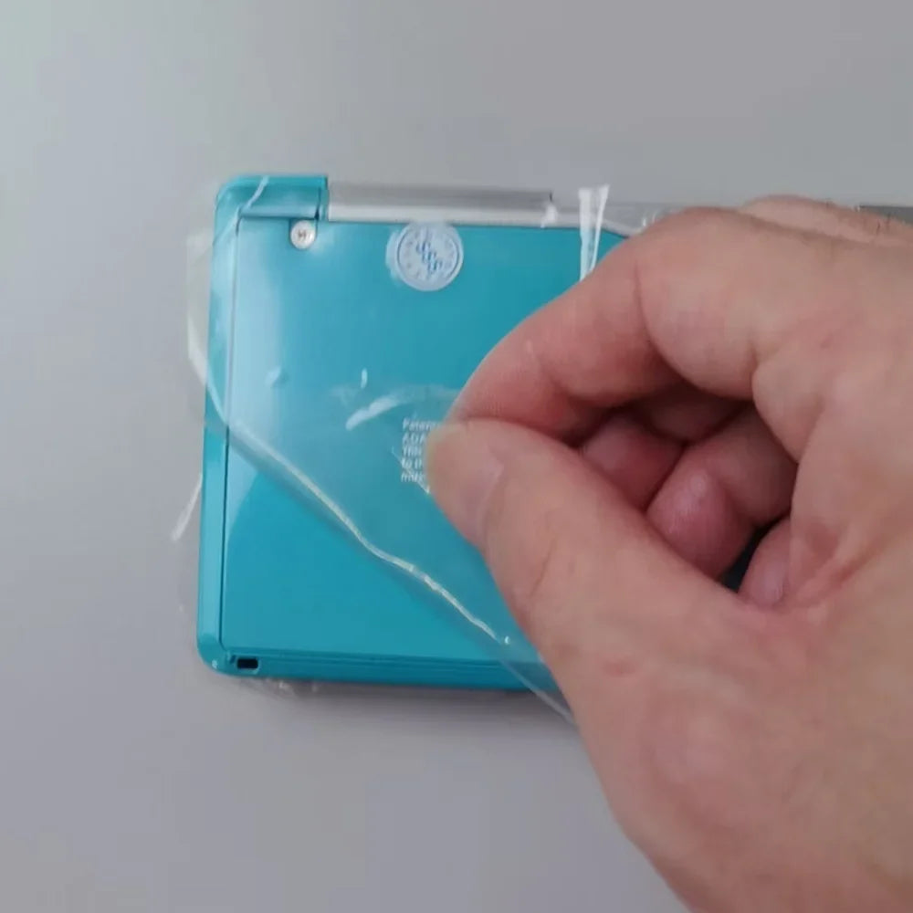 Turquoise Nintendo 3DS handheld console, refurbished, in plastic wrap on Tampa Home & Garden Store