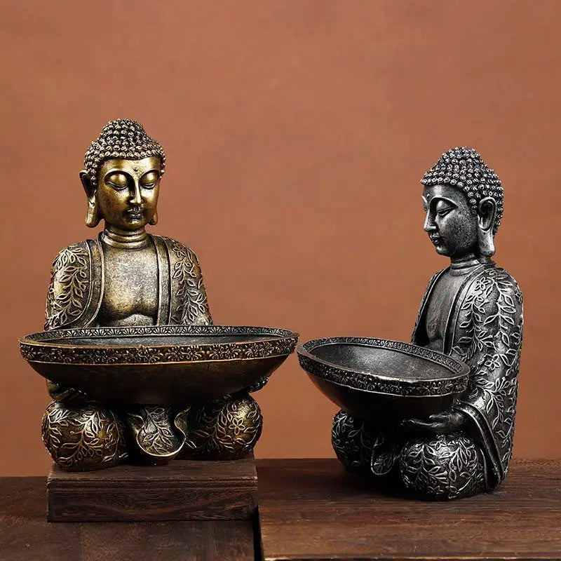 Dual Buddha resin statues in bronze and dark gray with ornate bowls for Fengshui decor on Tampa Home & Garden Store