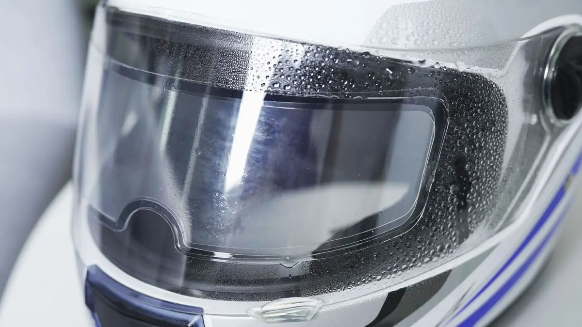 Anti-fog patch film rainproof helmet visor on a glossy motorcycle helmet with water droplets on Tampa Home & Garden Store