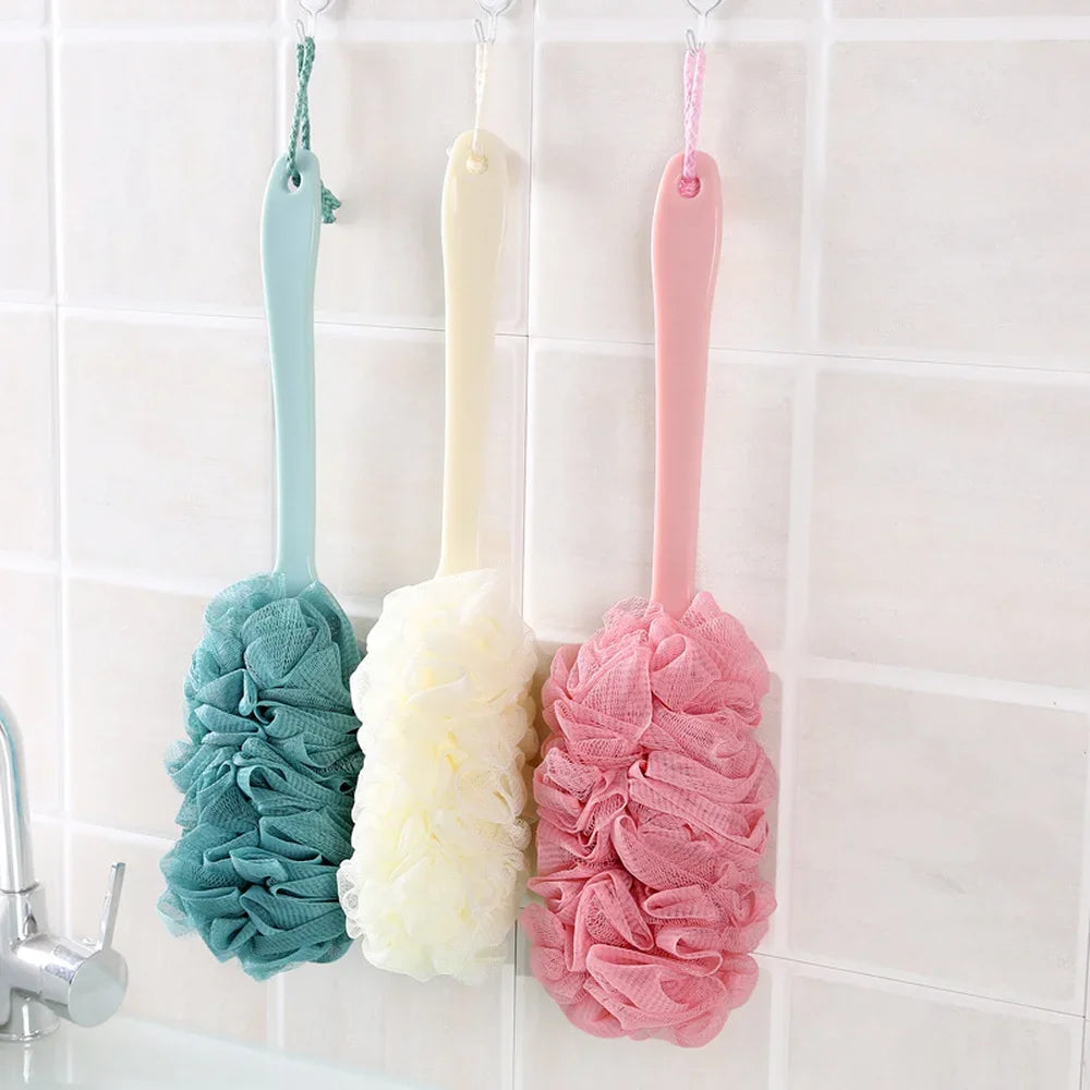 Three long-handle back brushes with soft mesh loofahs in teal, cream, and pink by Silcy Skin on Tampa Home & Garden Store
