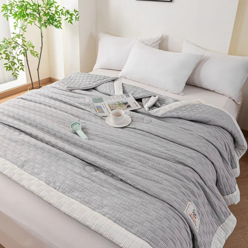 DecorBites Knitted Waffle Summer Quilt in gray with white border on bed breathable and thin on Tampa Home & Garden Store