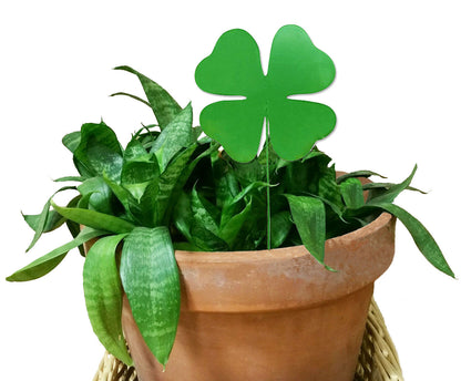 Shamrock plant stake ornament, green, in a terracotta pot with lush leafy plant on Tampa Home & Garden Store