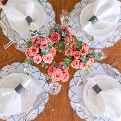 Arc Impermeable Placemat With Embroidered Border clear placemats with grey border on a table on Tampa Home & Garden Store