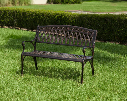 Simone Cast Aluminum Bench, dark bronze finish with lattice back and curved arms on Tampa Home & Garden Store