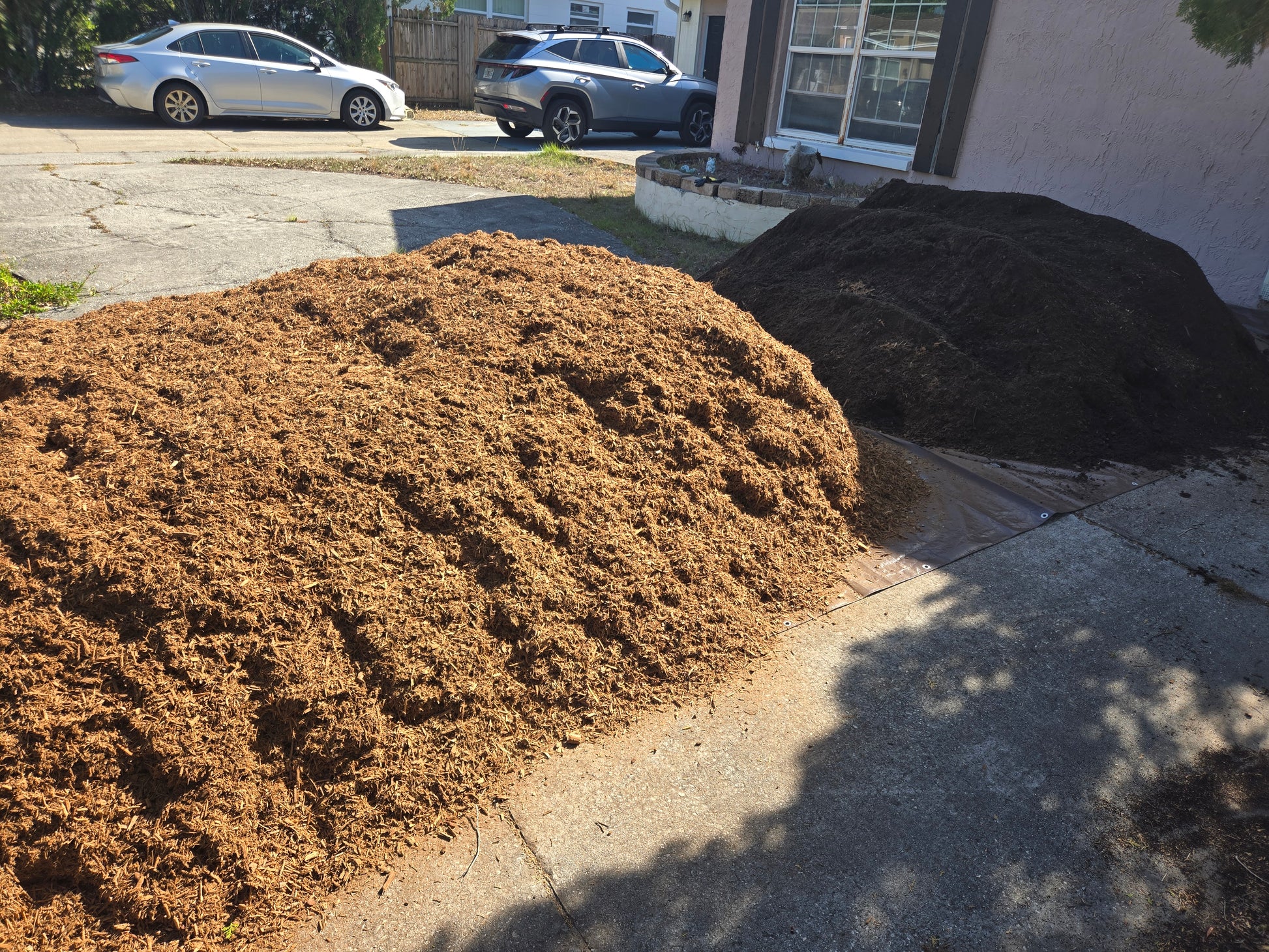 Mulch and soil delivered together saves money; dumped in separate piles.