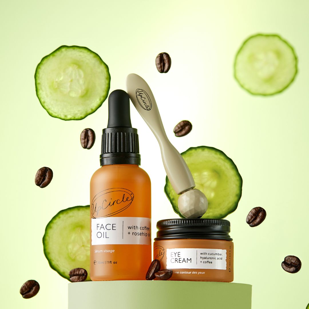Face oil and eye cream UpCircle: orange dropper bottle and cucumber eye cream jar on Tampa Home & Garden Store