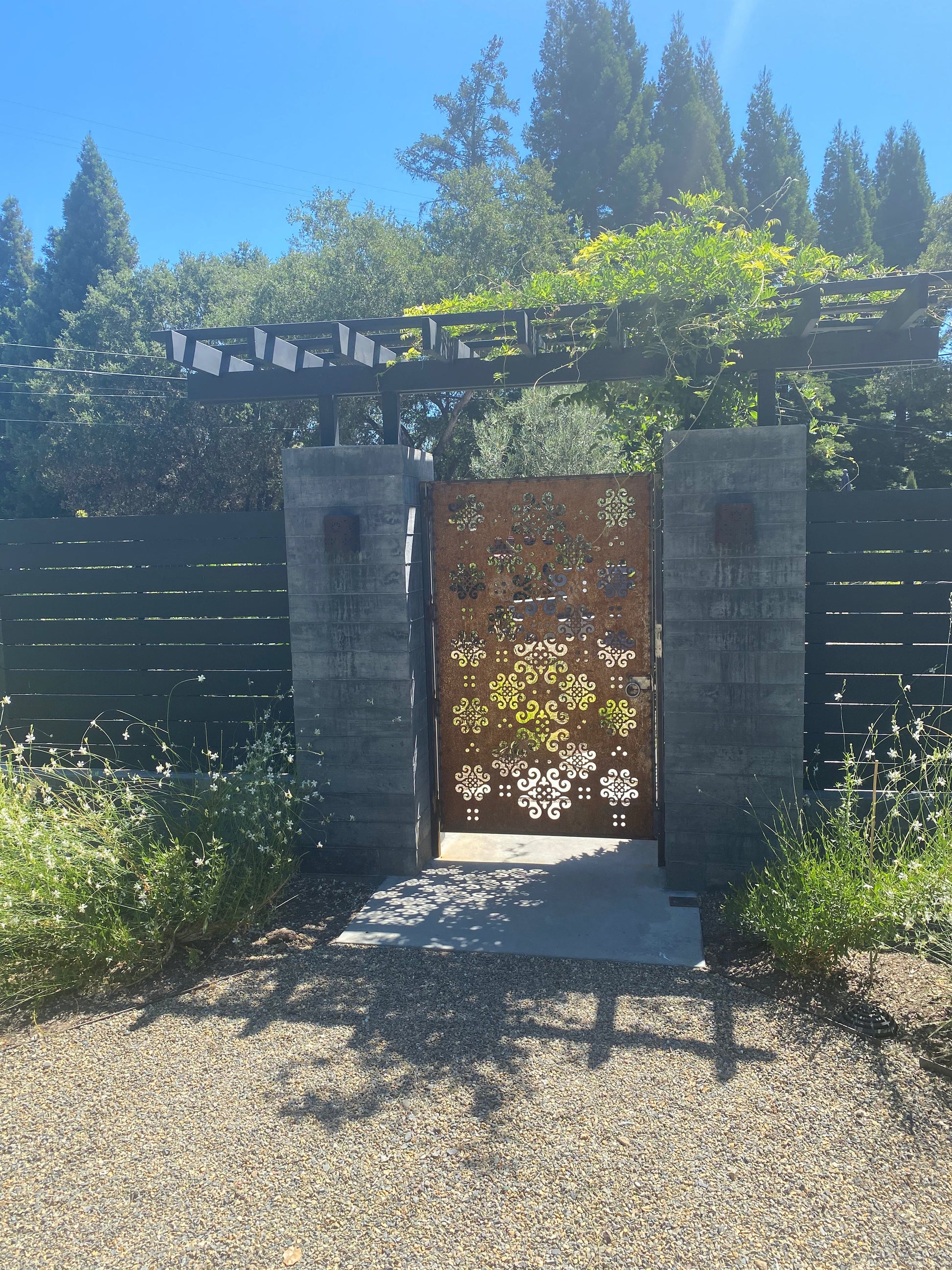 Outdoor Metal Privacy Screen Panel by Rustica Ornamentals in dark steel with ornate cutout on Tampa Home & Garden Store