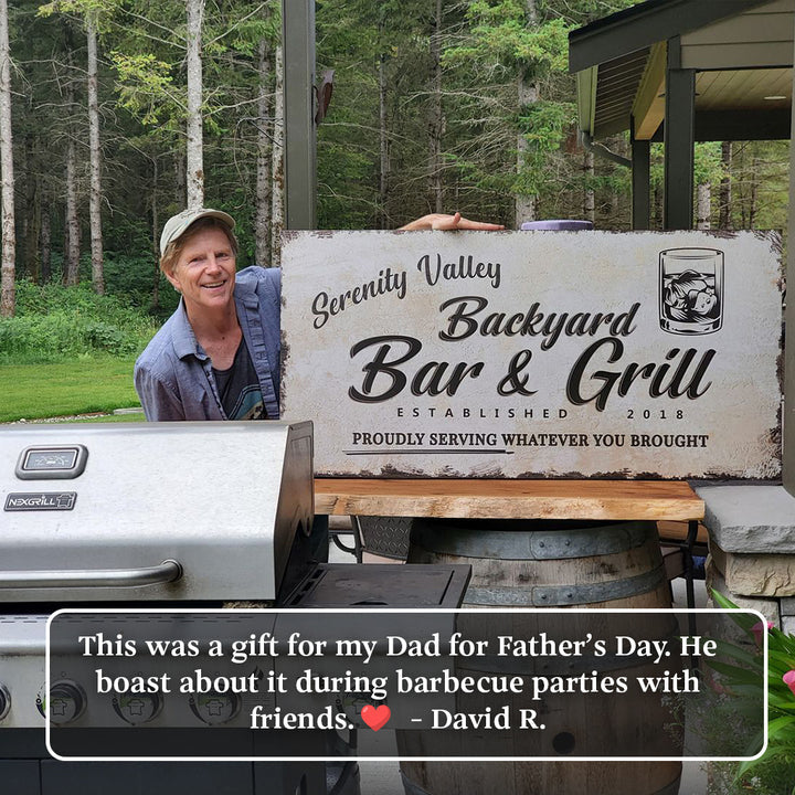 Backyard Bar & Grill Sign canvas by Tailored Canvases with rustic finish and black lettering on Tampa Home & Garden Store