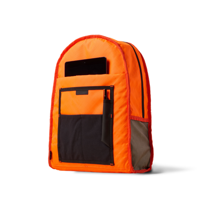 Standard Issue backpack orange with black pocket and phone pocket by The Brown Buffalo on Tampa Home & Garden Store