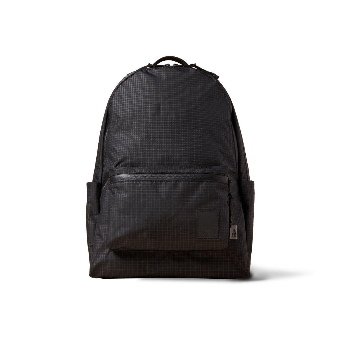 Standard Issue backpack by The Brown Buffalo in dark grid fabric with front pocket on Tampa Home & Garden Store