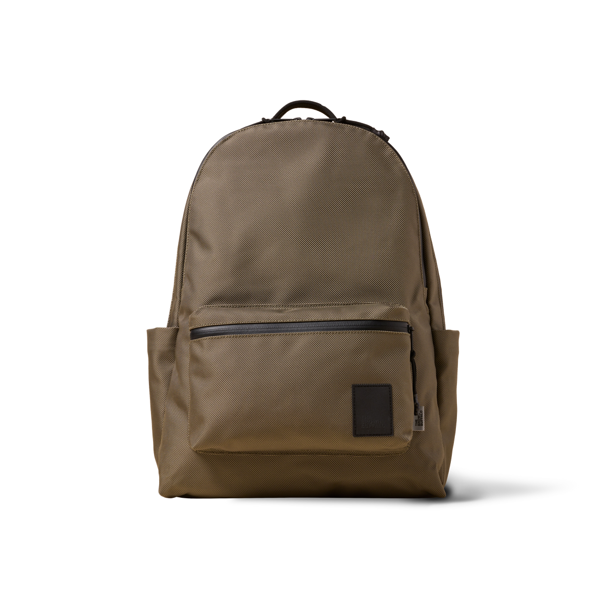 The Brown Buffalo Standard Issue backpack in tan fabric with top handle on Tampa Home & Garden Store