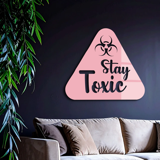 Stay Toxic warning sign metal wall art in pink triangle with biohazard symbol backdrop on Tampa Home & Garden Store