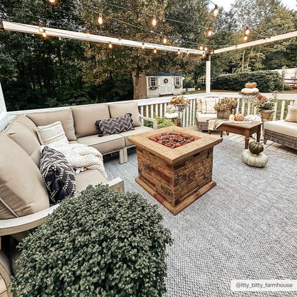 Stenhousemuir Luxe Handmade Rug outdoor gray woven rug under beige sectional seating on Tampa Home & Garden Store