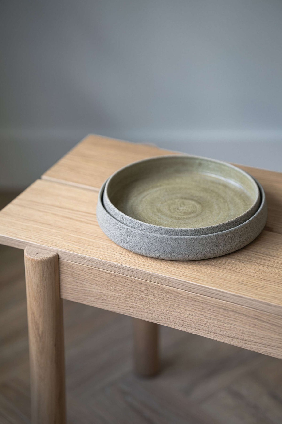 Two-piece stoneware dinner plates with high sides in concrete gray by CREATING COMFORT on Tampa Home & Garden Store
