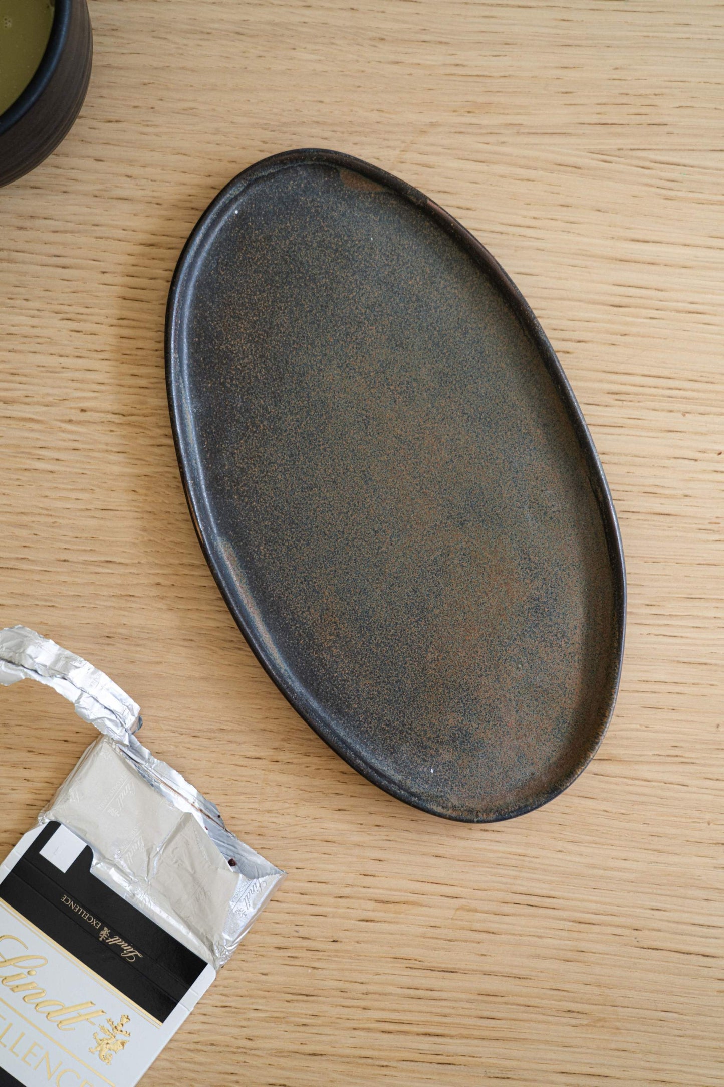 A Rust Matte Stoneware Serving Platter and Feast