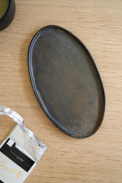 A Rust Matte Stoneware Serving Platter and Feast