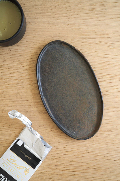 A Rust Matte Stoneware Serving Platter and Feast