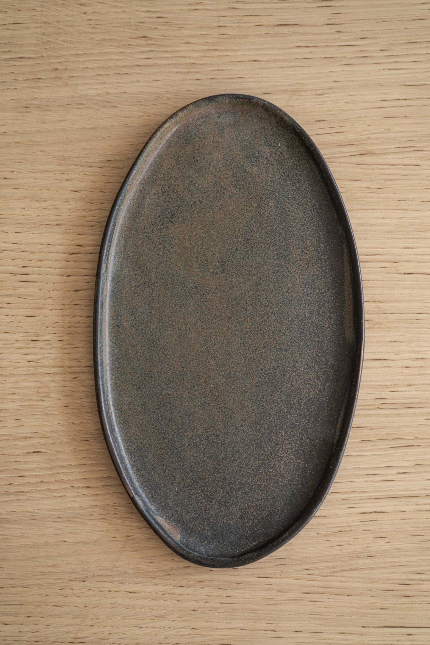 A Rust Matte Stoneware Serving Platter and Feast
