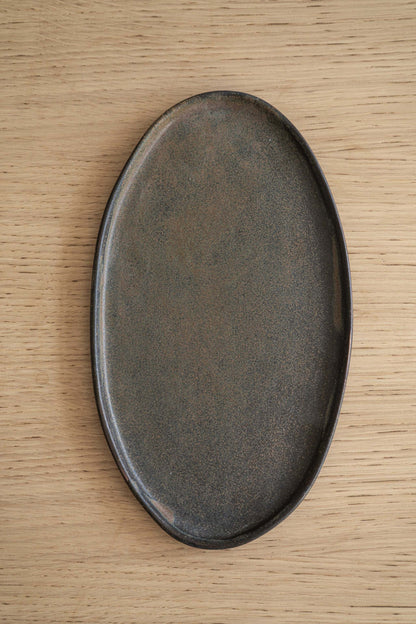 A Rust Matte Stoneware Serving Platter and Feast