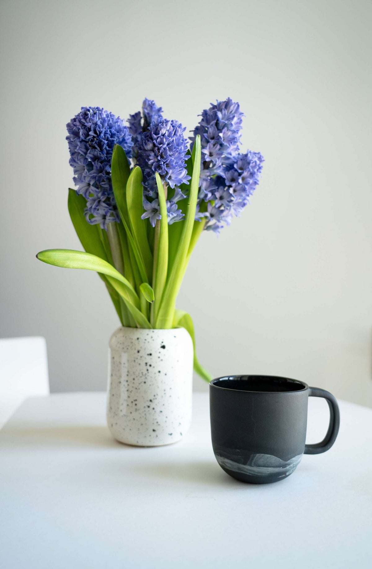 Handmade porcelain coffee mug in matte black with curved handle on Tampa Home & Garden Store