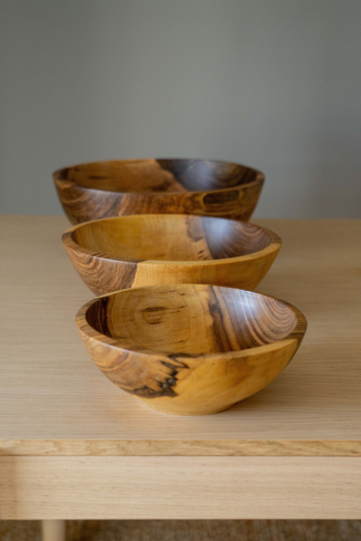 Hand Carved Walnut Wood Nesting Bowl Set of four with natural grain and warm tones on Tampa Home & Garden Store