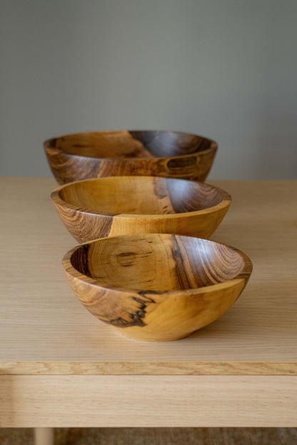 Hand Carved Walnut Wood Nesting Bowl Set of four with natural grain and warm tones on Tampa Home & Garden Store