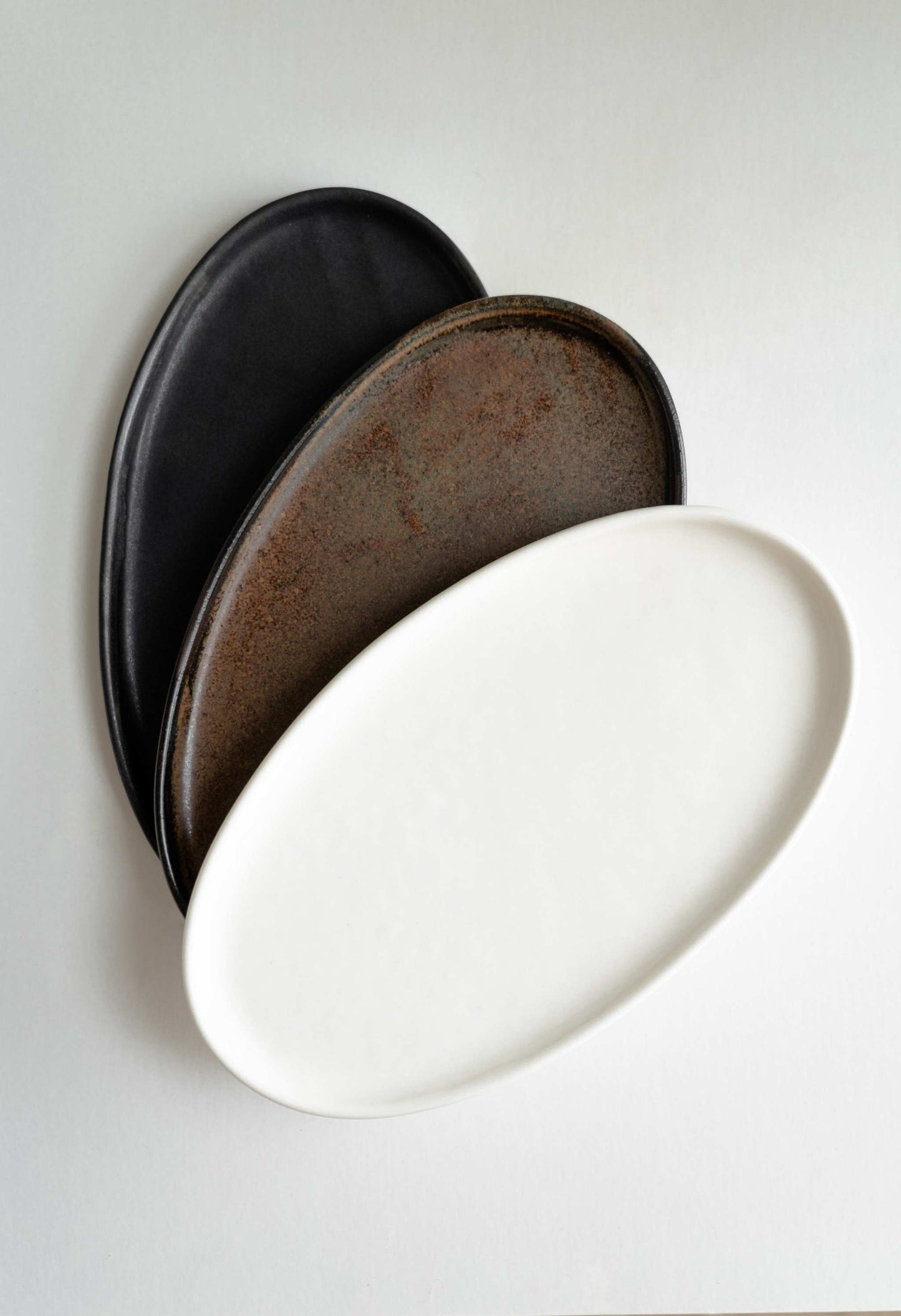 A Rust Matte Stoneware Serving Platter and Feast
