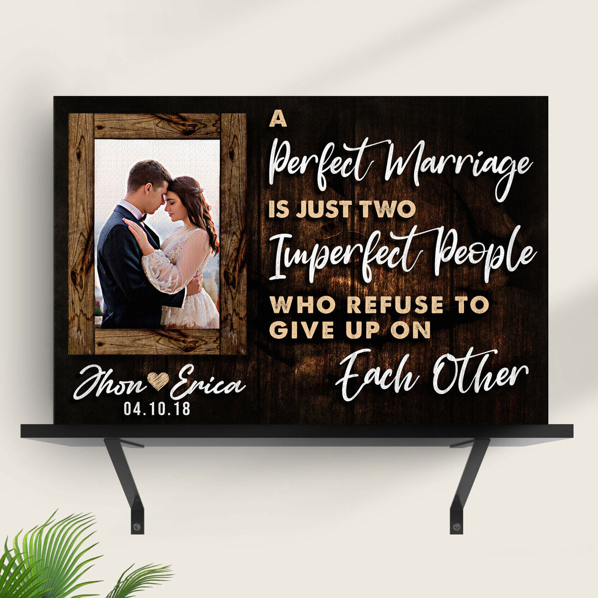 Canvas sign by Tailored Canvases with dark wood backdrop and couple portrait inset on Tampa Home & Garden Store