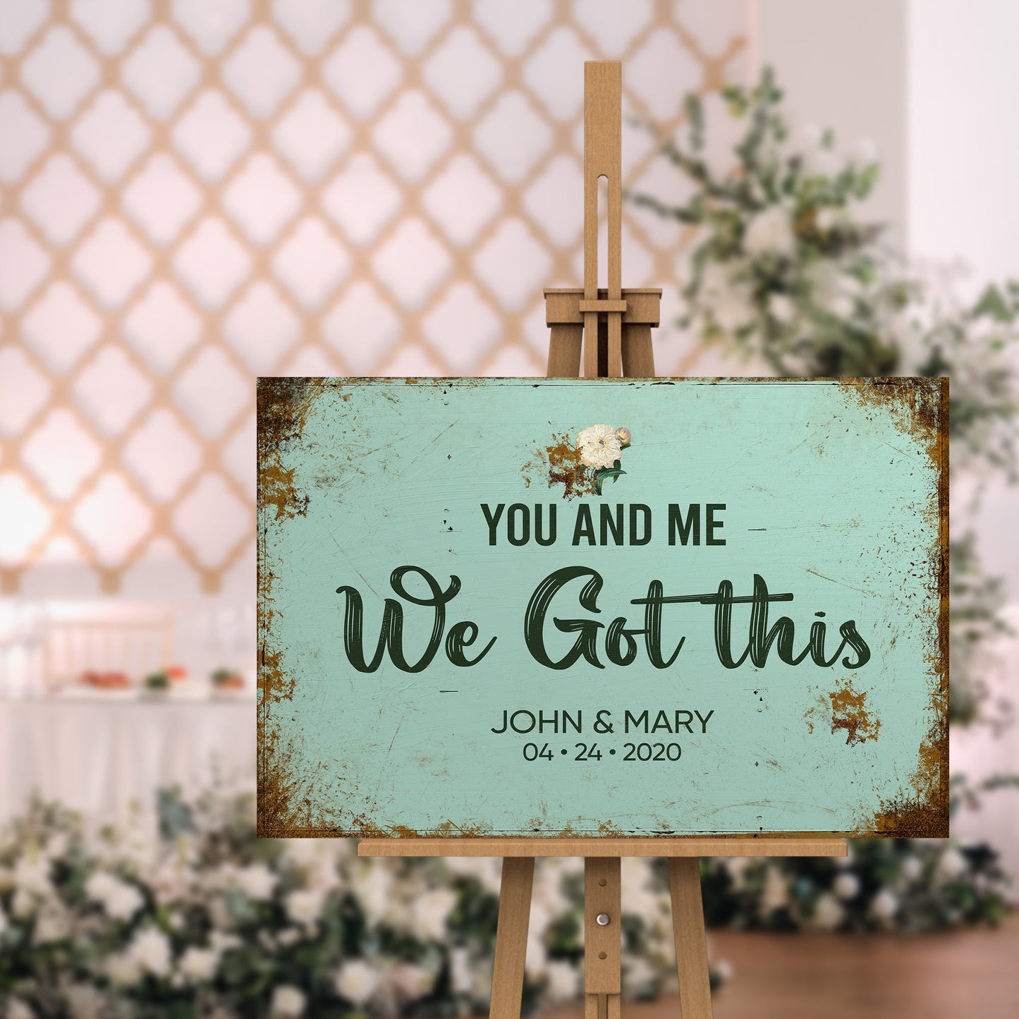 Canvas wedding sign on a wood easel with teal finish displaying You And Me We Got This on Tampa Home & Garden Store
