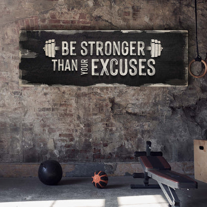Be Stronger Than Your Excuses Sign II canvas wall art with white lettering and dumbbell icons on a dark rustic background on Tampa Home & Garden Store
