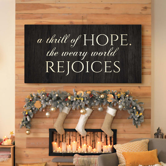 Canvas sign with ivory script reading a thrill of HOPE the weary world REJOICES on Tampa Home & Garden Store