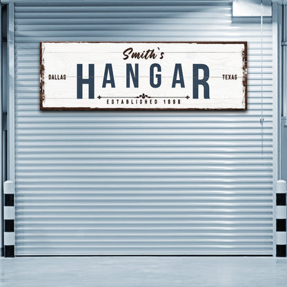 Hangar Sign canvas by Tailored Canvases white wood brown frame navy HANGAR lettering Dallas TX on Tampa Home & Garden Store