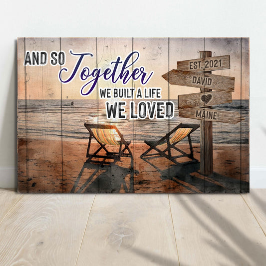 Canvas sign on weathered wood reads And So Together We Built A Life We Loved with wood chairs on Tampa Home & Garden Store