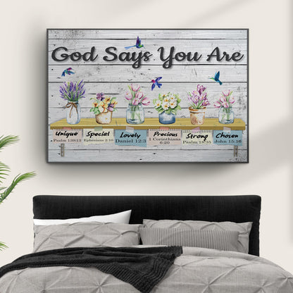Canvas sign God Says You Are by Tailored Canvases on rustic wood with colorful flowers on Tampa Home & Garden Store