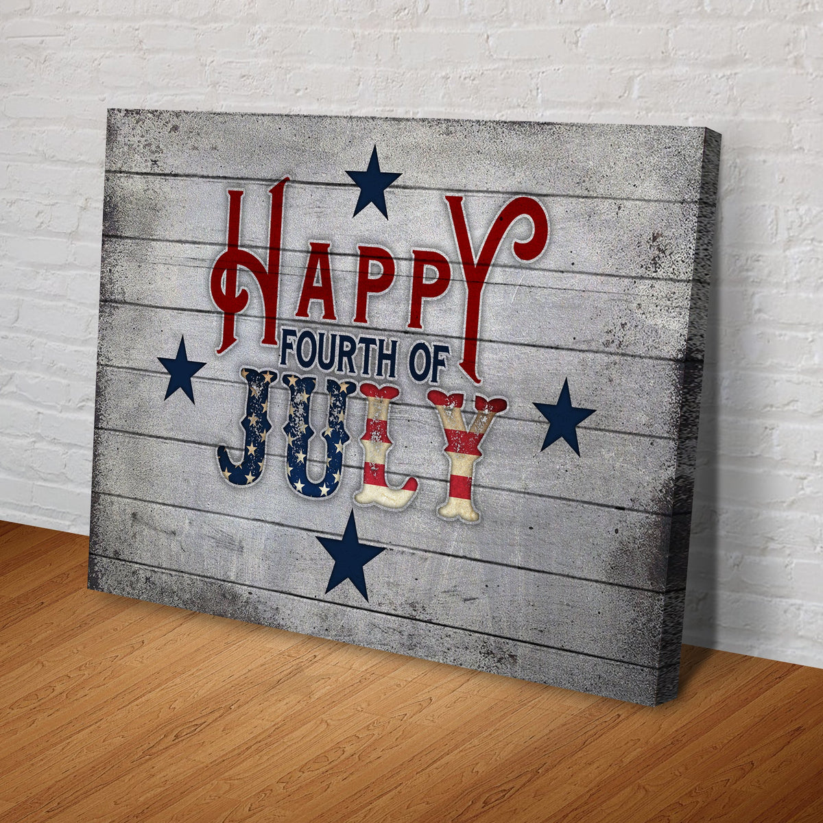 Happy Fourth of July canvas sign with red lettering and blue stars on rustic wood panel on Tampa Home & Garden Store