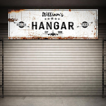 Hangar Sign II canvas with white, rusted sign and vintage airplane motif EST 1998 on Tampa Home & Garden Store