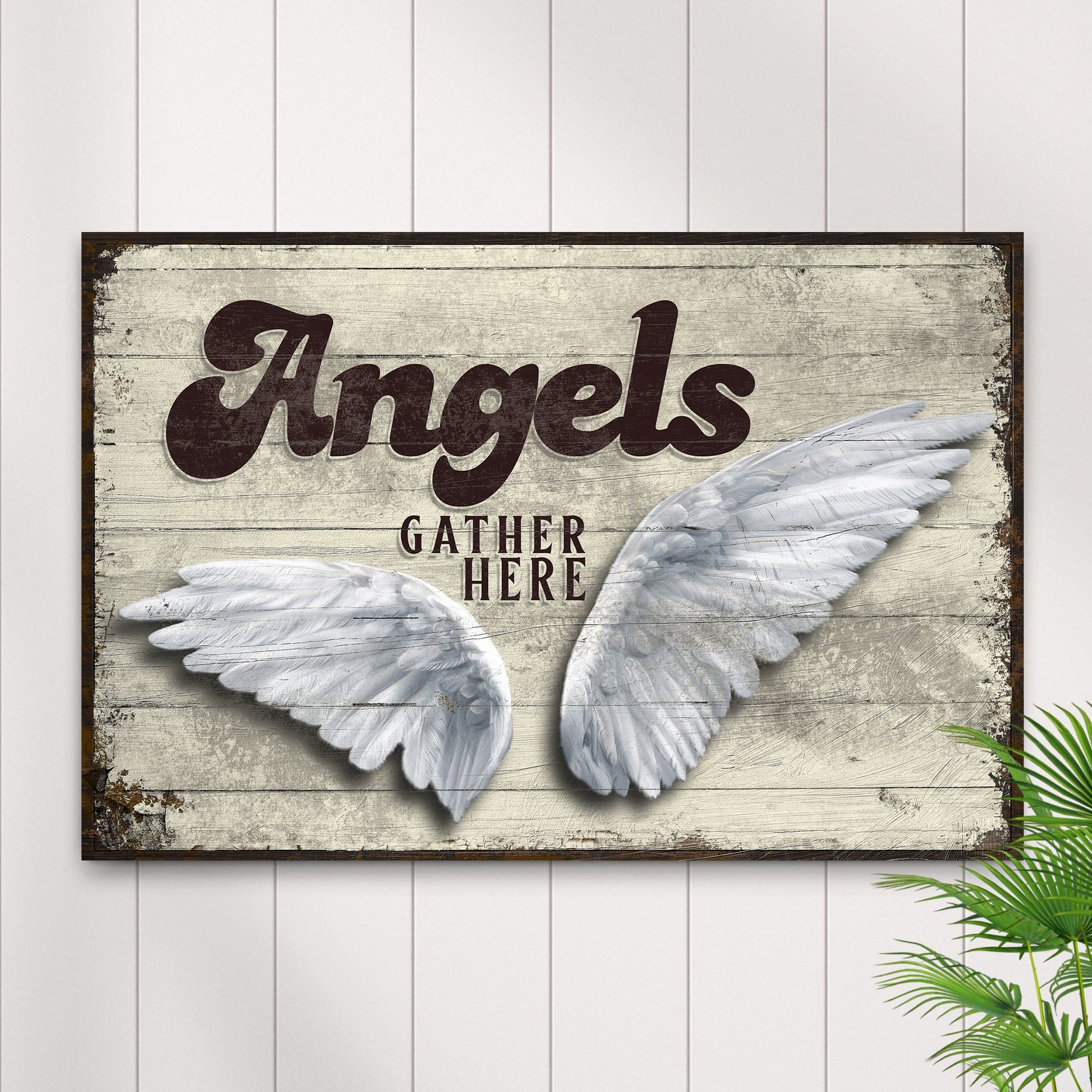 Angels Gather Here Sign II canvas by Tailored Canvases with distressed wood backdrop and white feather wings on Tampa Home & Garden Store
