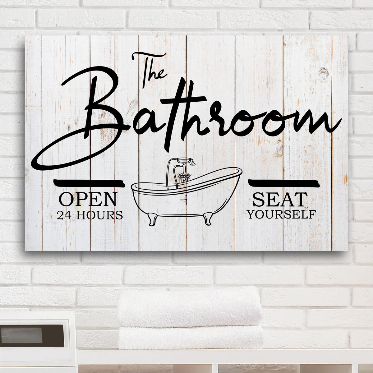 The Bathroom Sign canvas with distressed white wood planks and bold black script lettering on Tampa Home & Garden Store