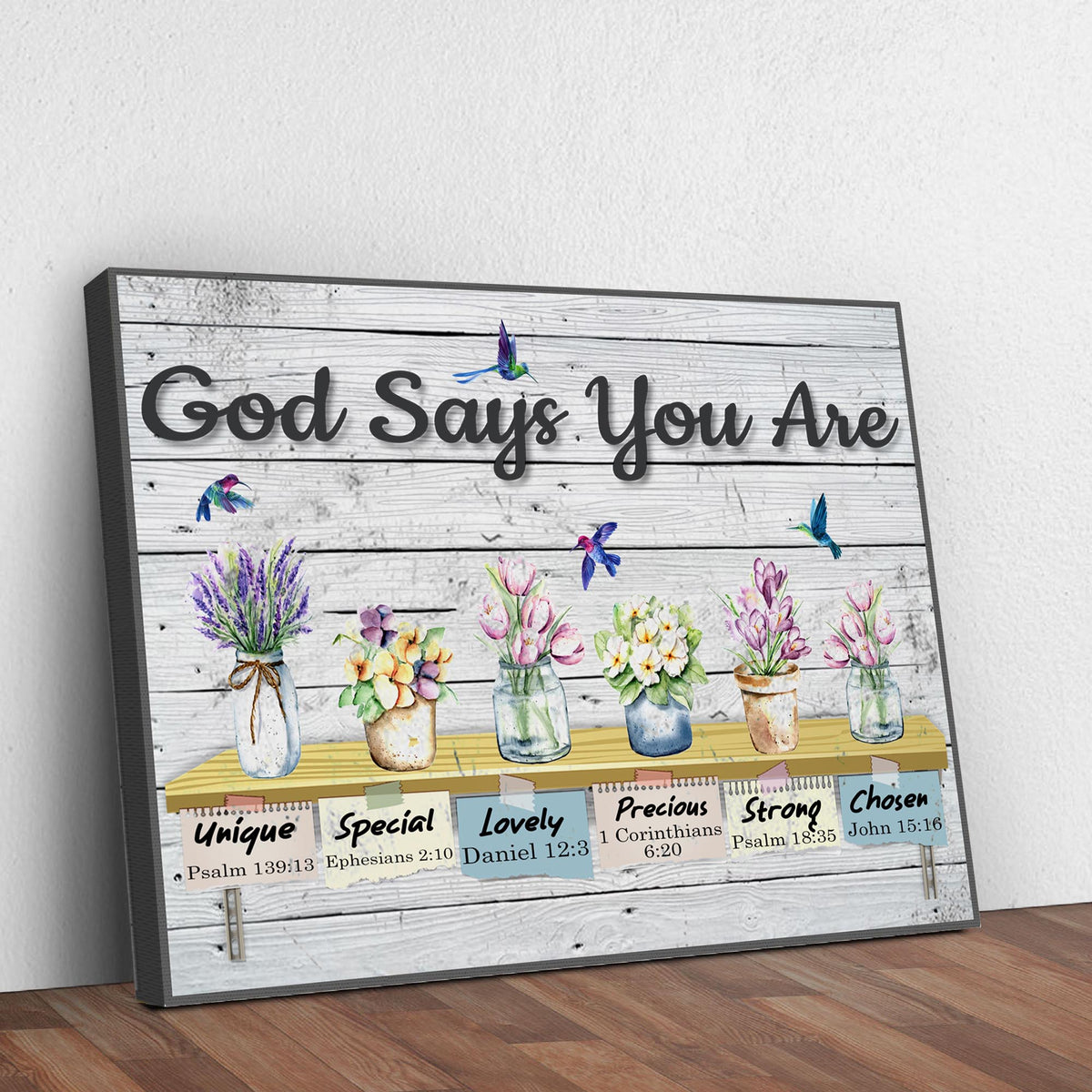 Canvas sign God Says You Are with distressed white wood backdrop and vibrant blooms on Tampa Home & Garden Store