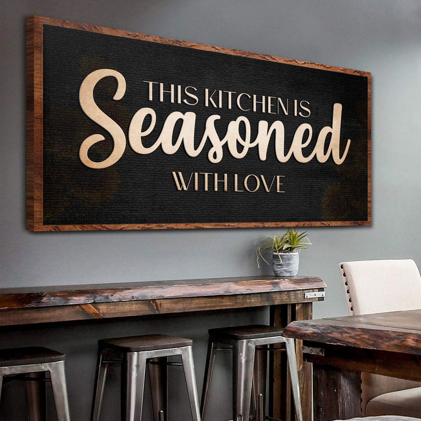 Canvas sign This Kitchen Is Seasoned With Love Sign on black textured surface with copper frame on Tampa Home & Garden Store