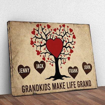 Grandkids Make Life Grand canvas sign featuring a black heart tree and red hearts on parchment on Tampa Home & Garden Store