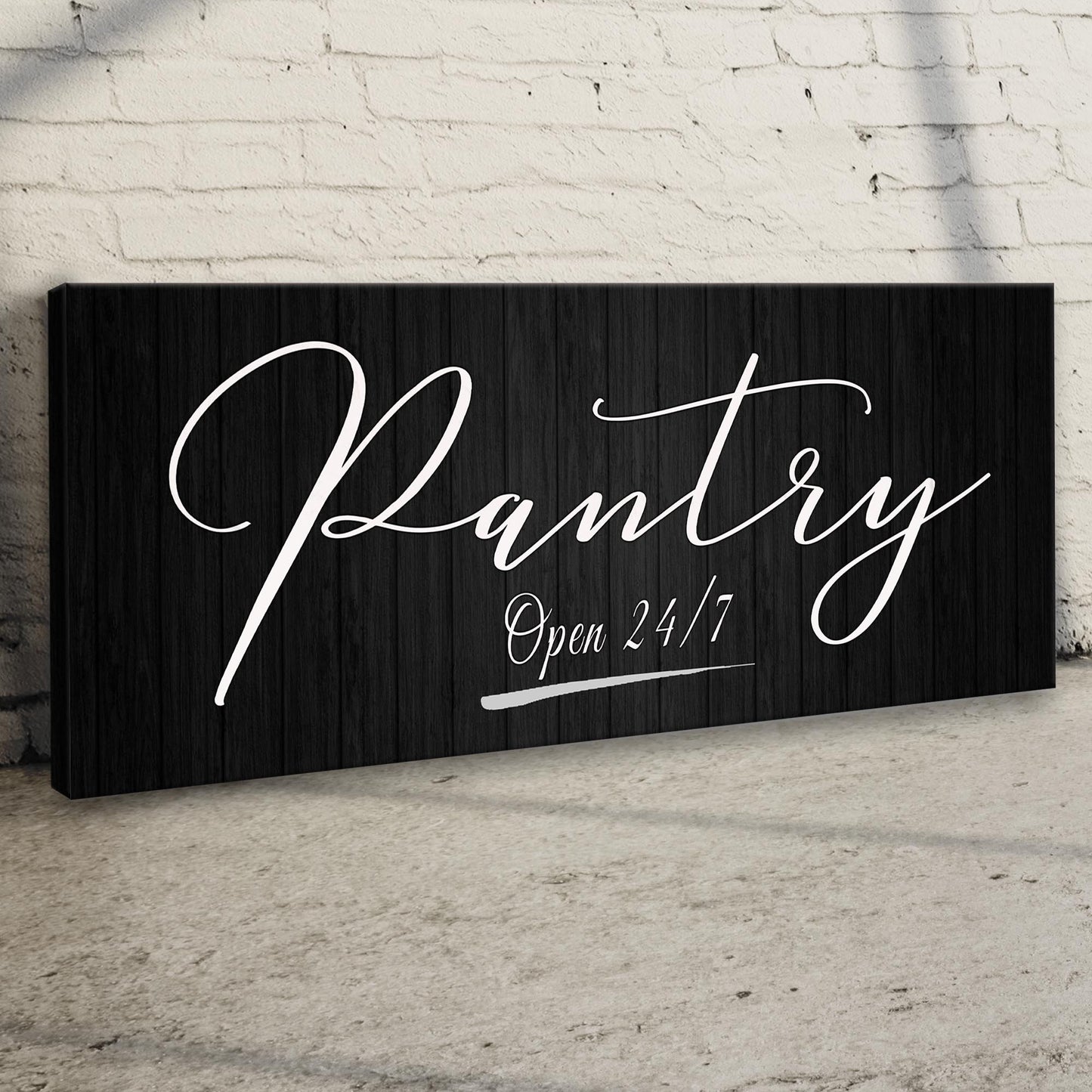 Pantry Open 24/7 sign on a black wood panel with white cursive text on Tampa Home & Garden Store
