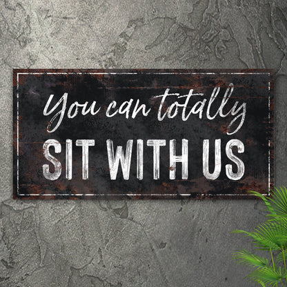 Tailored Canvases canvas sign reading You Can Totally Sit With Us in black and white script on Tampa Home & Garden Store