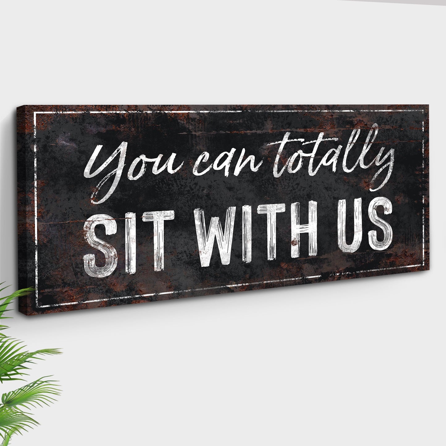 Canvas sign You Can Totally Sit With Us in black distressed rustic finish with white chalk text on Tampa Home & Garden Store