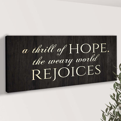 Canvas sign with woodgrain and ivory script reading A Thrill Of Hope The Weary World Rejoices on Tampa Home & Garden Store