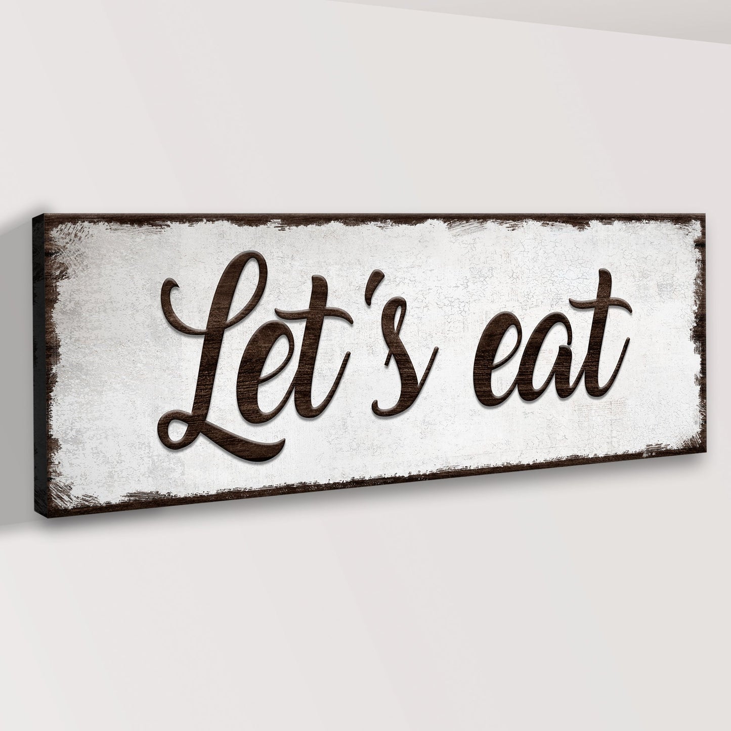 Let's Eat Sign canvas with dark brown frame and script lettering on Tampa Home & Garden Store