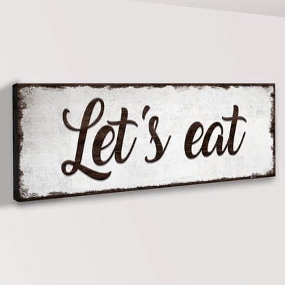 Let's Eat Sign canvas with dark brown frame and script lettering on Tampa Home & Garden Store