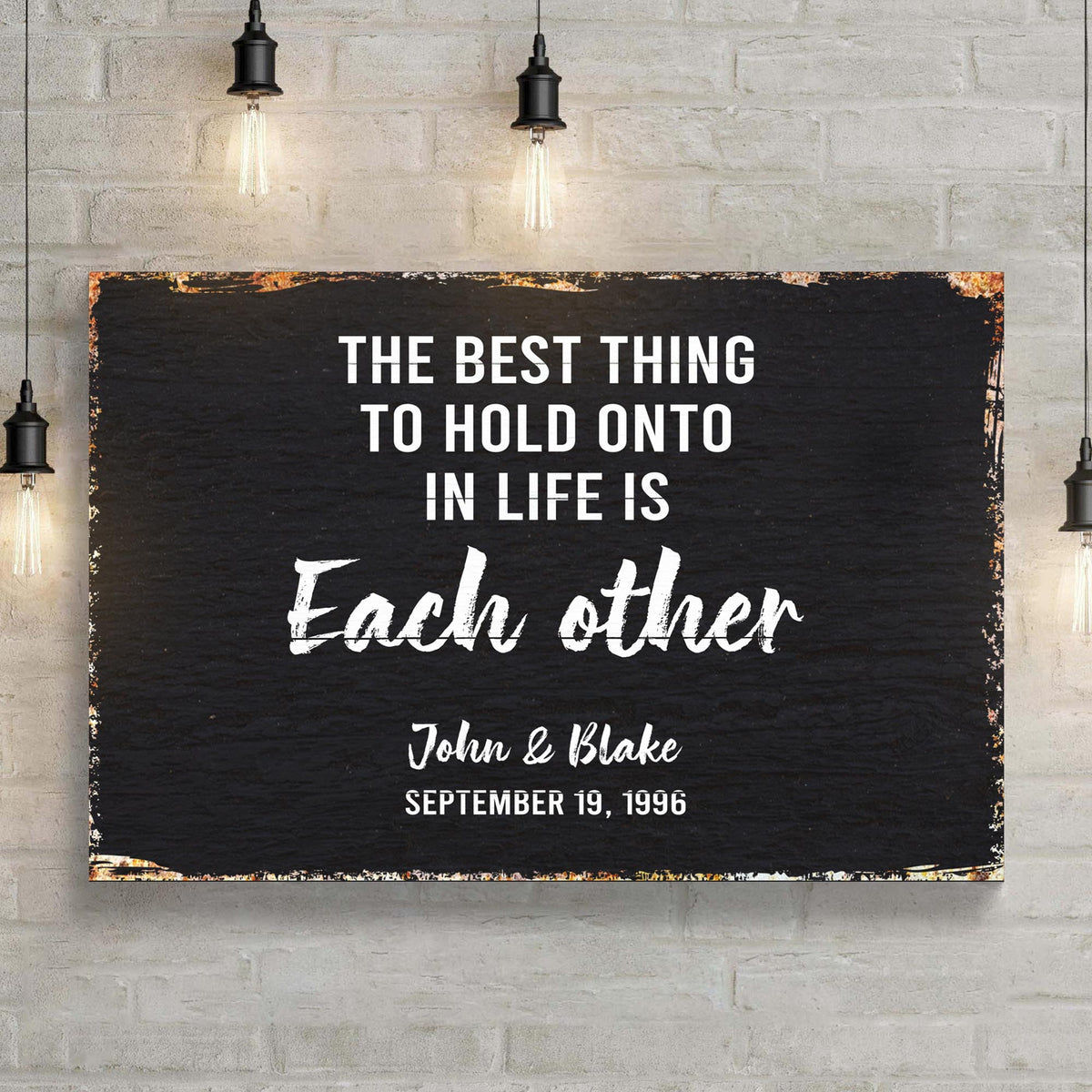Canvas sign The Best Thing To Hold Onto Life Is Each Other, white on black on Tampa Home & Garden Store