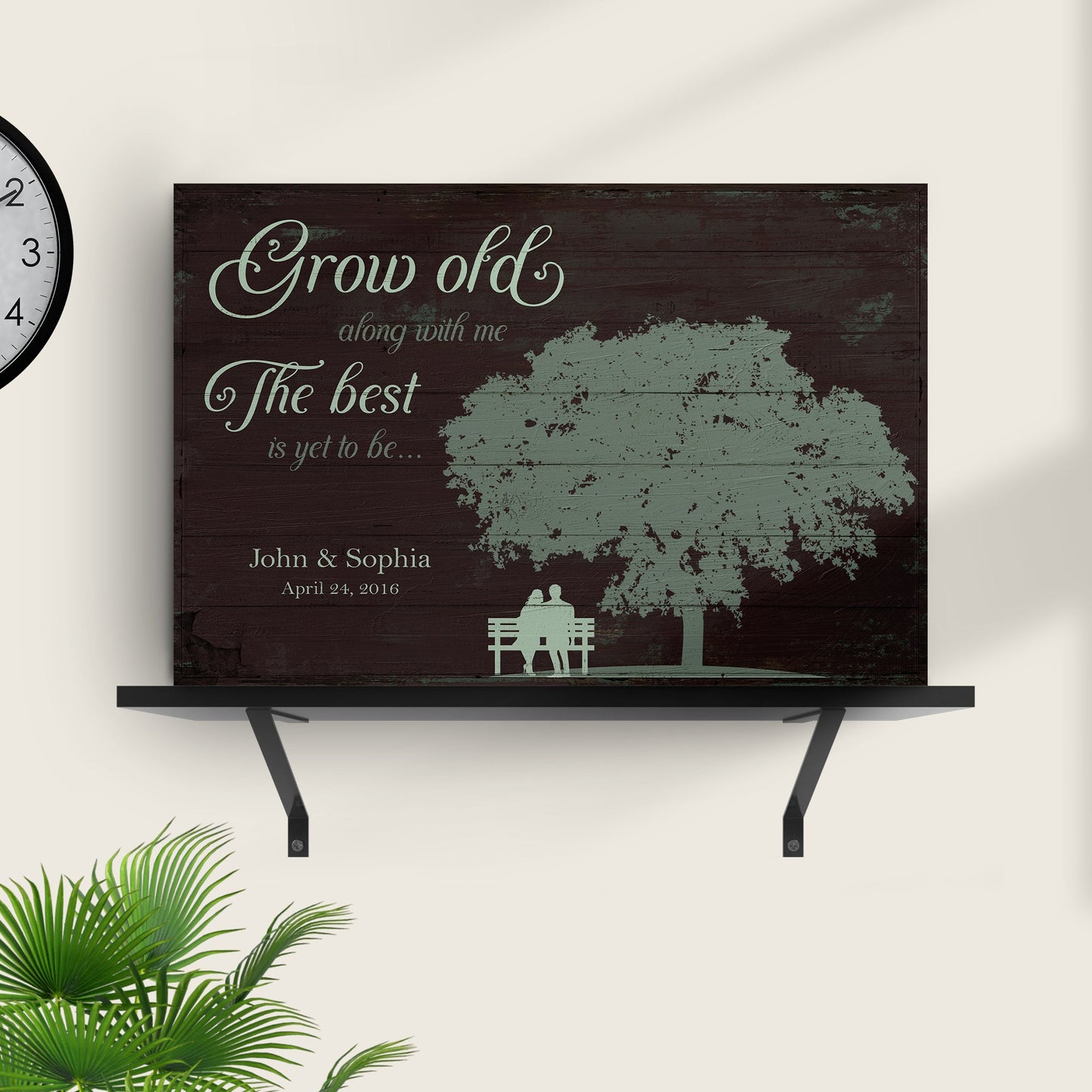 Grow Old Along With Me canvas sign on dark wood panel with pale blue script text and bench silhouette on Tampa Home & Garden Store