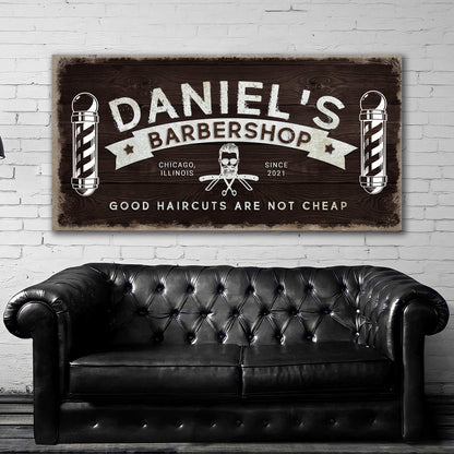 Barbershop sign canvas with dark wood grain and white barber poles on both sides on Tampa Home & Garden Store